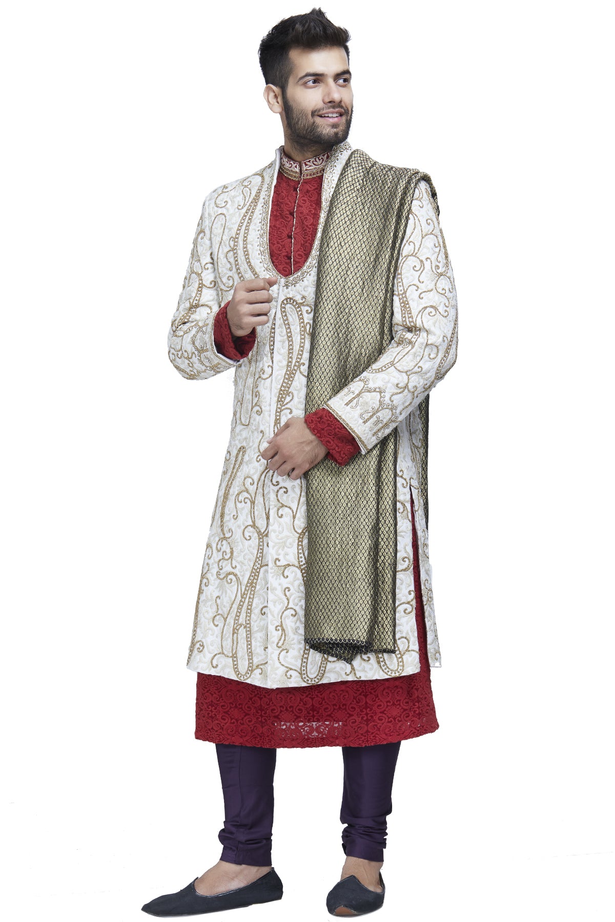 Four piece Ivory sherwani with maroon kurta inside and a purple dupatta and chuddidar is the show-stopper sherwani. Get ready to be the center of attention when you walk around wearing this outfit.
