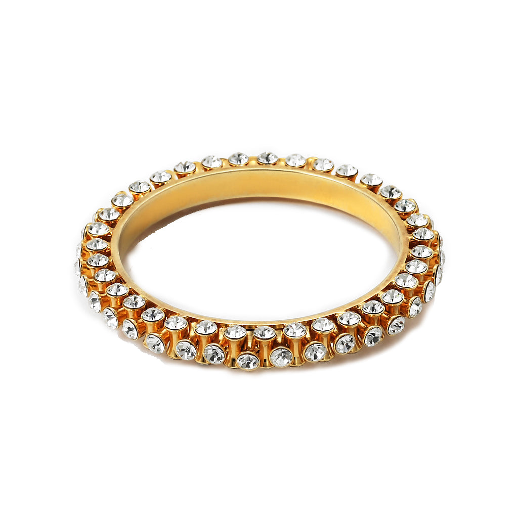 This absolute wardrobe must-have is a classic bangle made of gold-plated brass and embellished crystals.