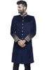 Royal blue velvet sherwani with gold buttons and embroidery detailings at collar and cuff. There are no pants with it.
