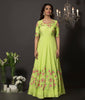 Lime green cold shoulder floral gown in cotton silk with hancrafted resham embroidery. The flowers are highlighted using golden cut-dana and fine pearls.