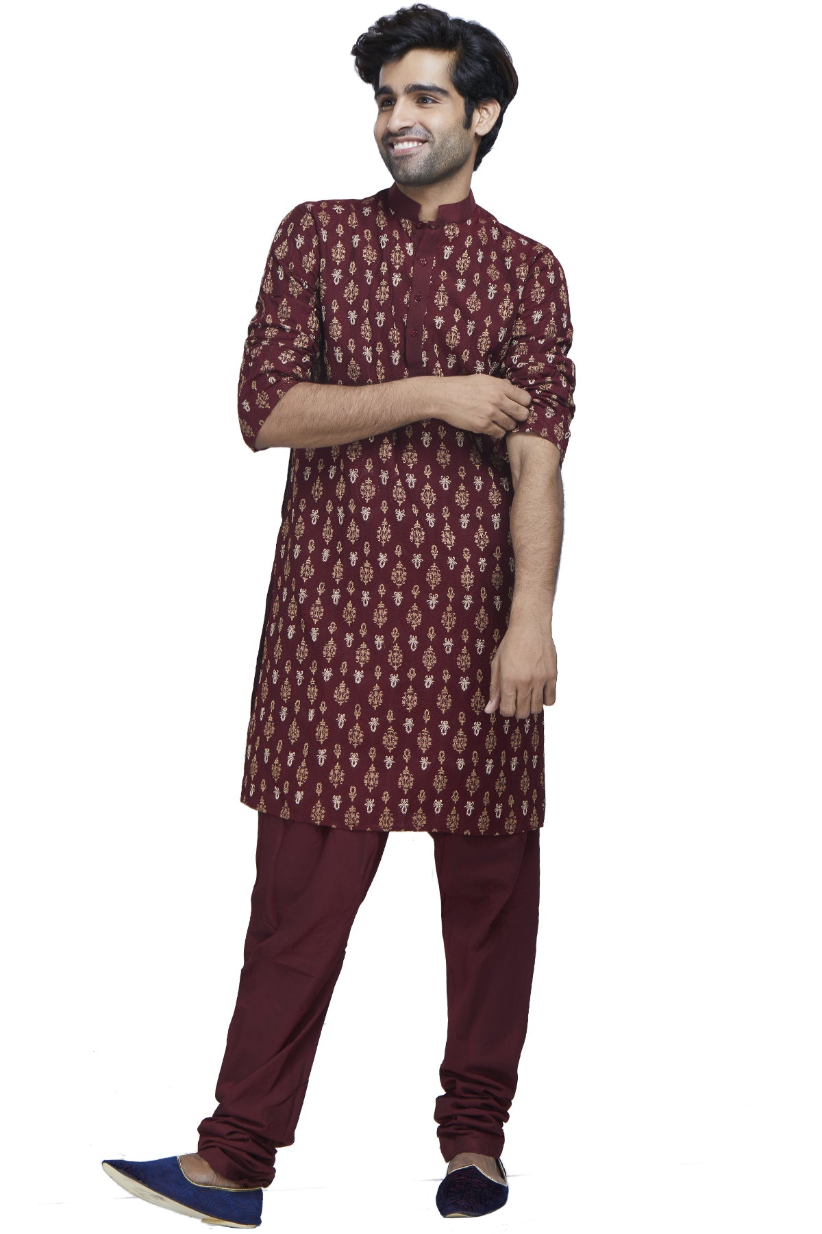 In a seizing blend of texture and rich colour, this maroon georgette kurta with maroon and gold threadwork and zari embroidery is paired with comfortable silk churidars.