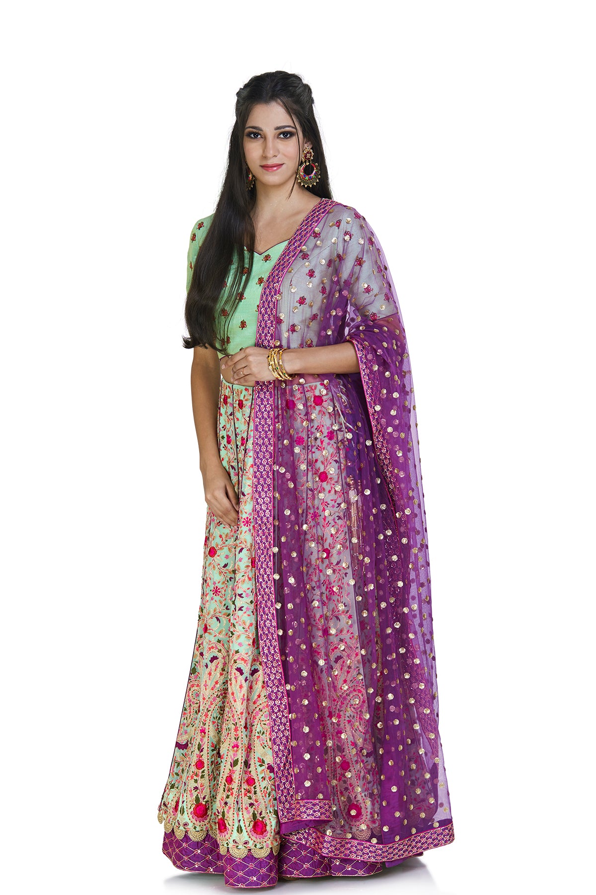Go ahead and stun in this mint green embroidered lehenga set with a contrasting net dupatta for your next big occasion. 
