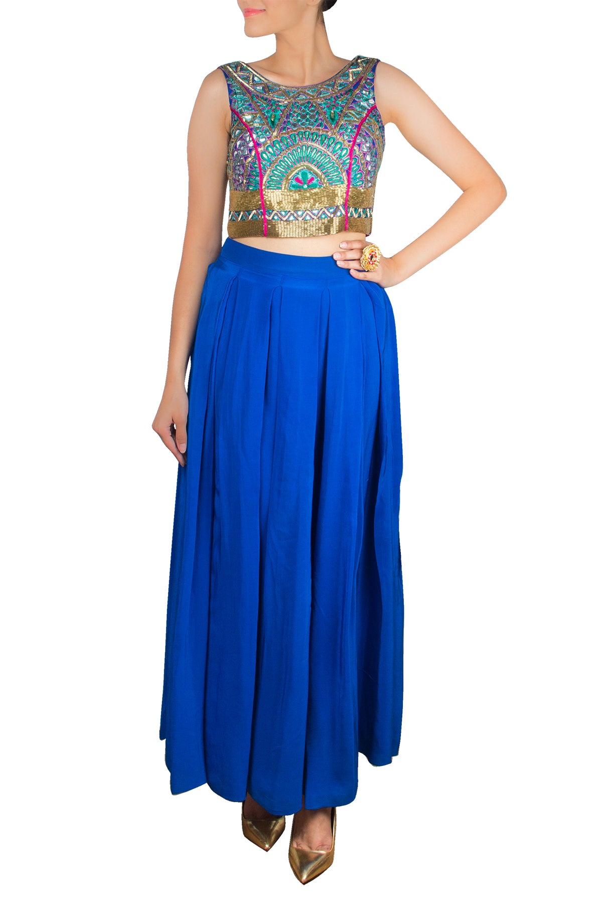 Go colour crazy for a vibrant outdoor function in our embroidered crop top embellished with peacock motiifs over a blue high-waisted crepe skirt with a hot pink lining.