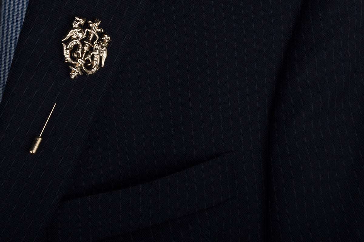A subtle addition that reeks of regal royalty - this lapel pin is lavishly decorated with an intricate design and spreads the sentiment of sophistication. 