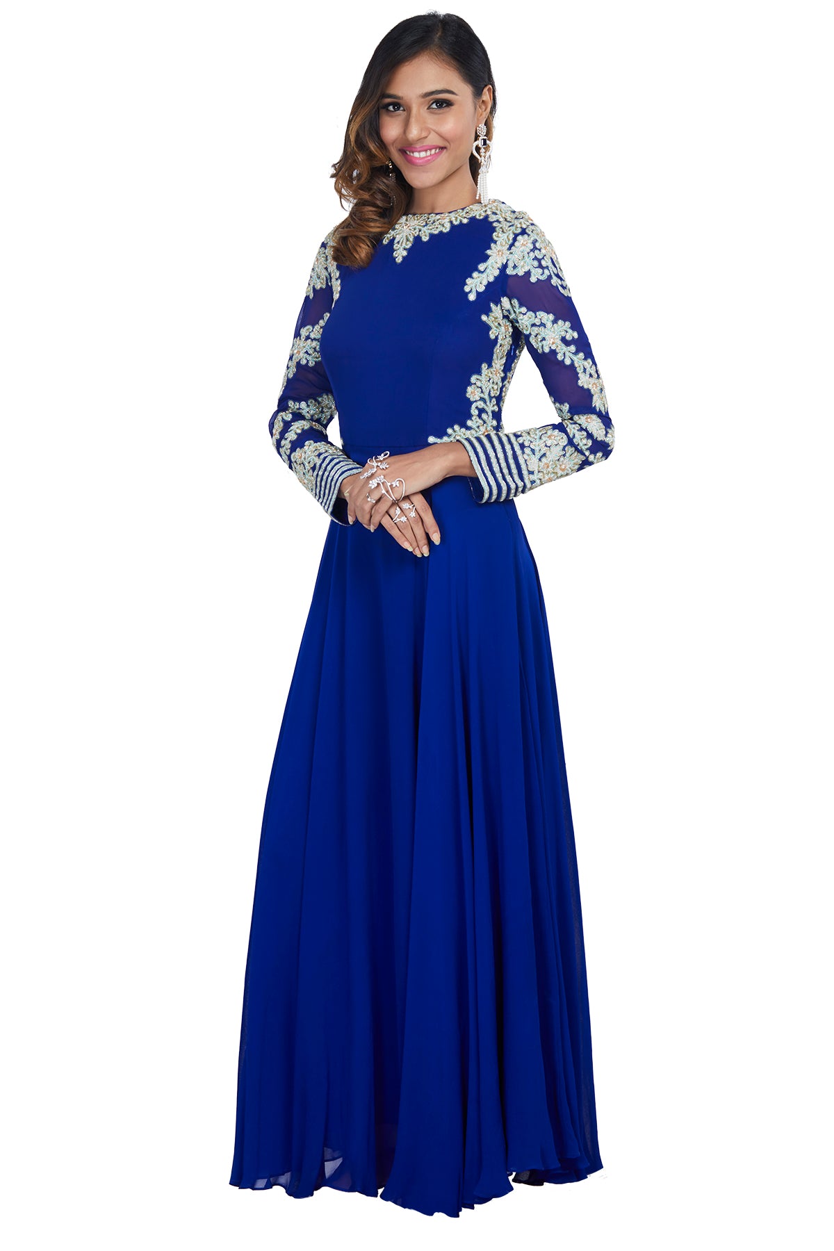 Be the mesmerising vision of majesty in this royal blue georgette gown with a boat neck and fully embroidered sleeves in white & mint green threadwork.
