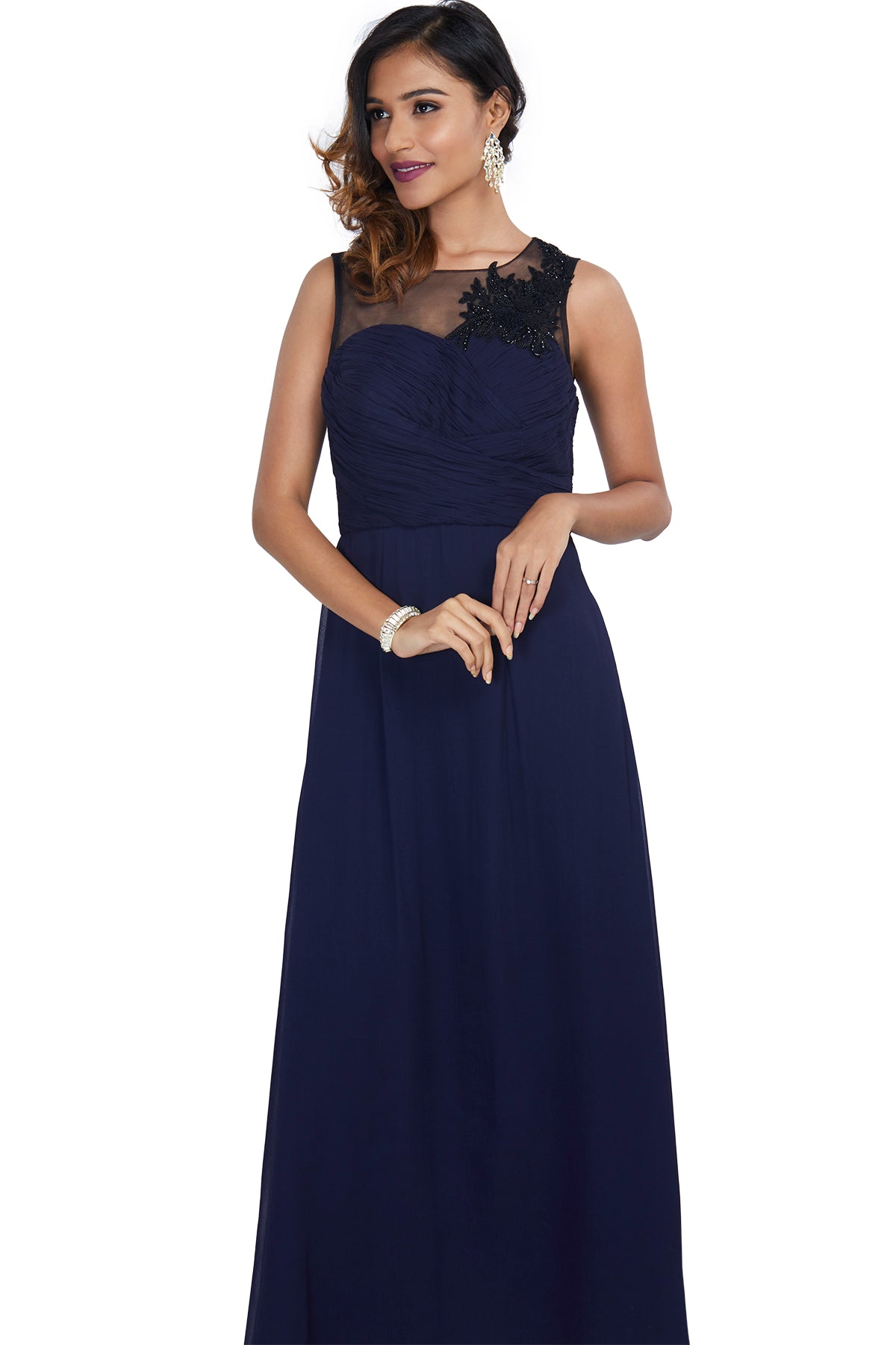 We wouldn't be surprised if he blew you a kiss in this regal navy blue gown finished with a black sweet-heart neck with floral patchwork. 
