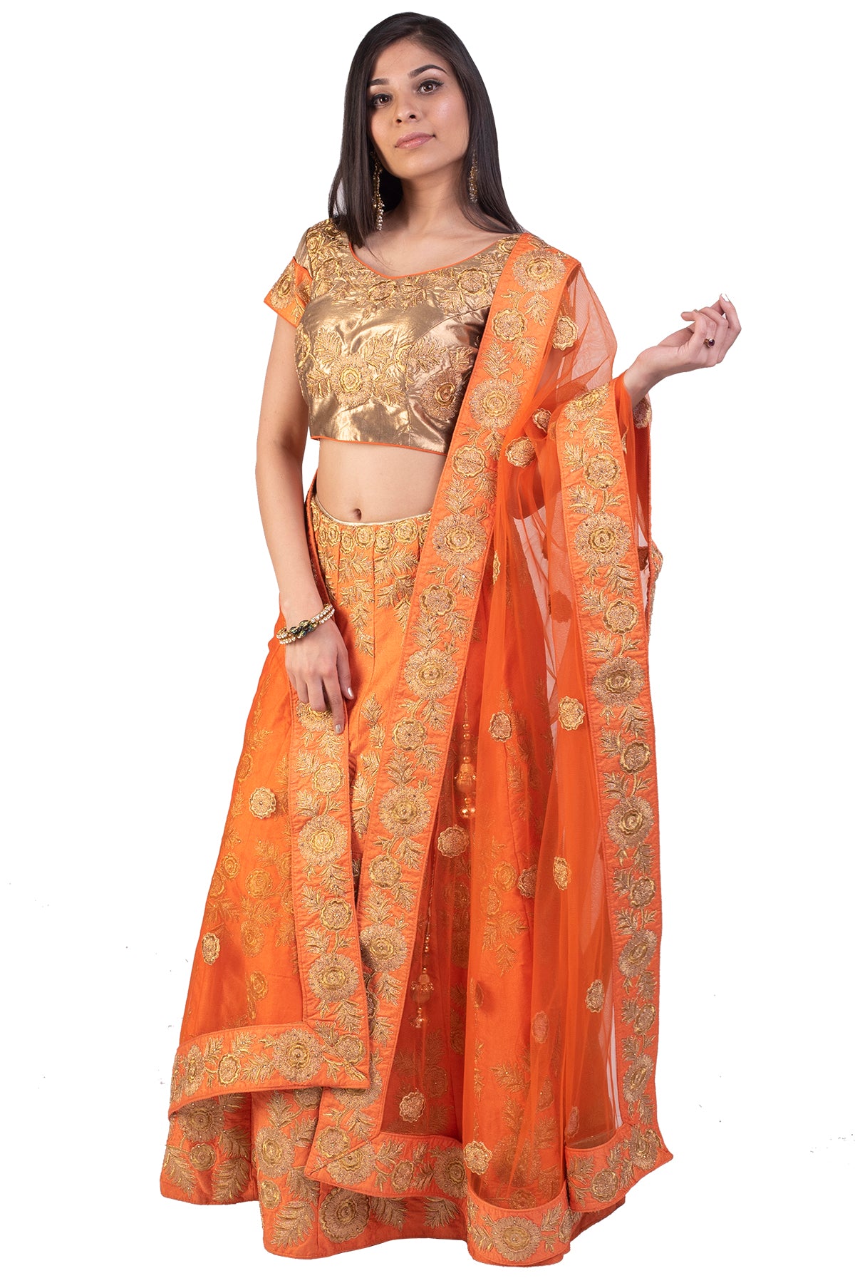The intricate floral work in zardosi on the orange lehenga is perfect for a mehendi and sangeet function. A show-stopper look, without a doubt.