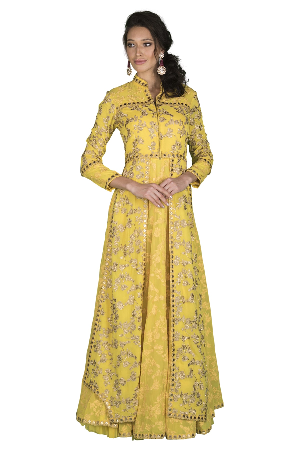 Look smart in this yellow jacket lehenga with silver detailing. It has a sleeveless anarkali/gown on the inside with an embroidered jacket on the top.
