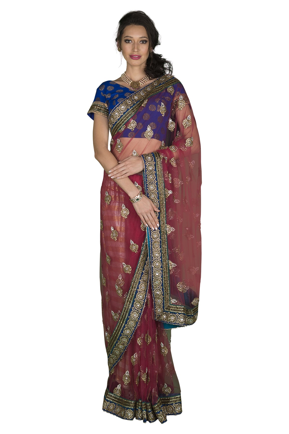 Maroon net saree with gold border and a brocade blue blouse. Please note that the petticoat is not included.
