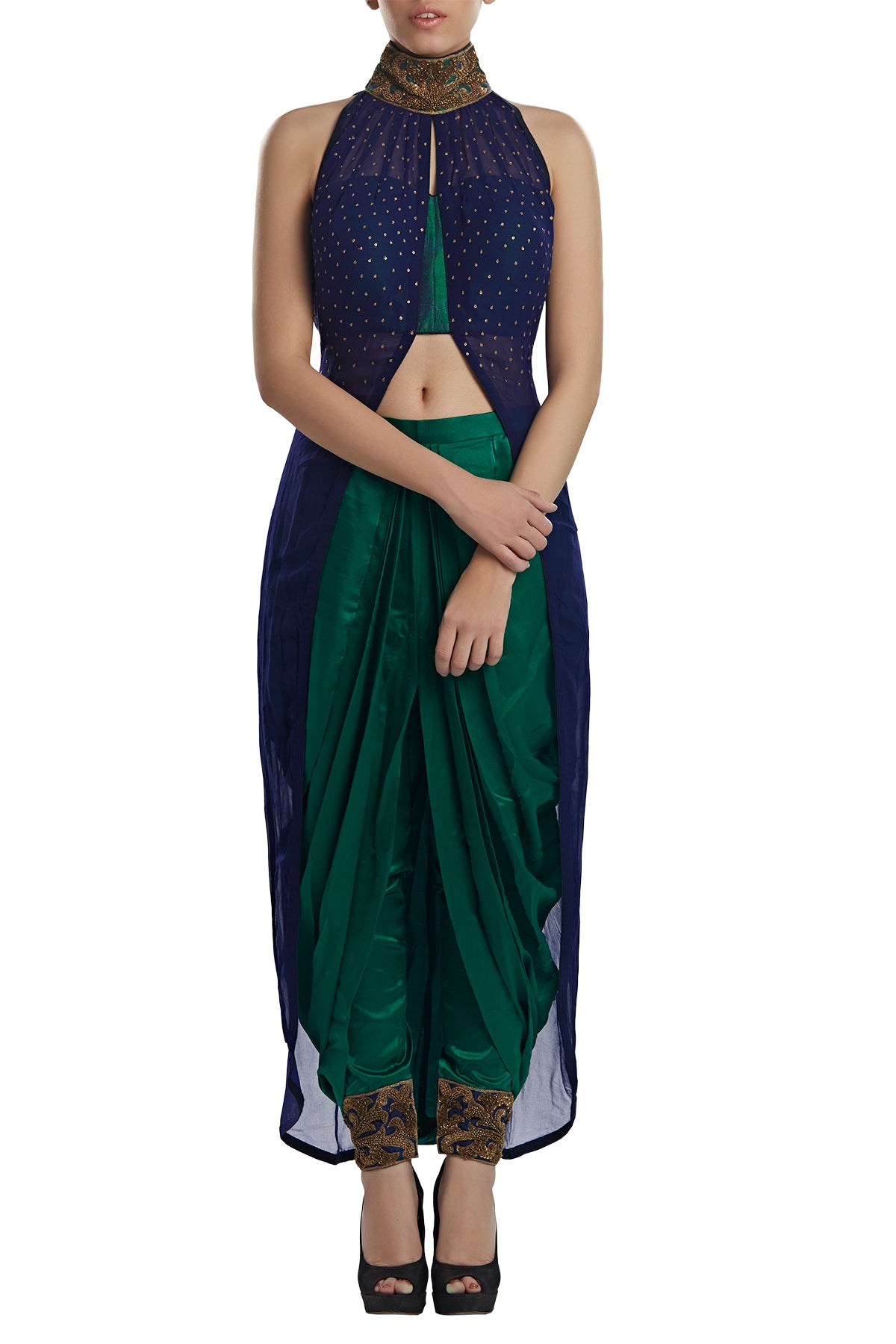 This one's a keeper and should creep into your every wedding suitcase! From welcome dinners to cocktails to evening mehendis when styled right, get your hands on our blue georgette high neck top with satin draped dhoti pants.