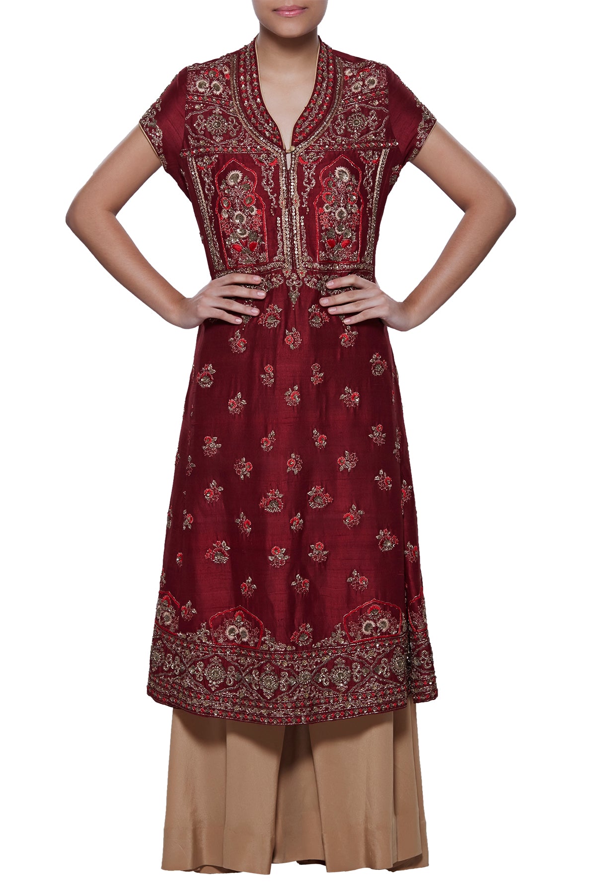 Like a striking illusion of the night, this maroon raw silk kurta is studded with zardosi embroidery and starstruck with its sheen gold palazzo pants.