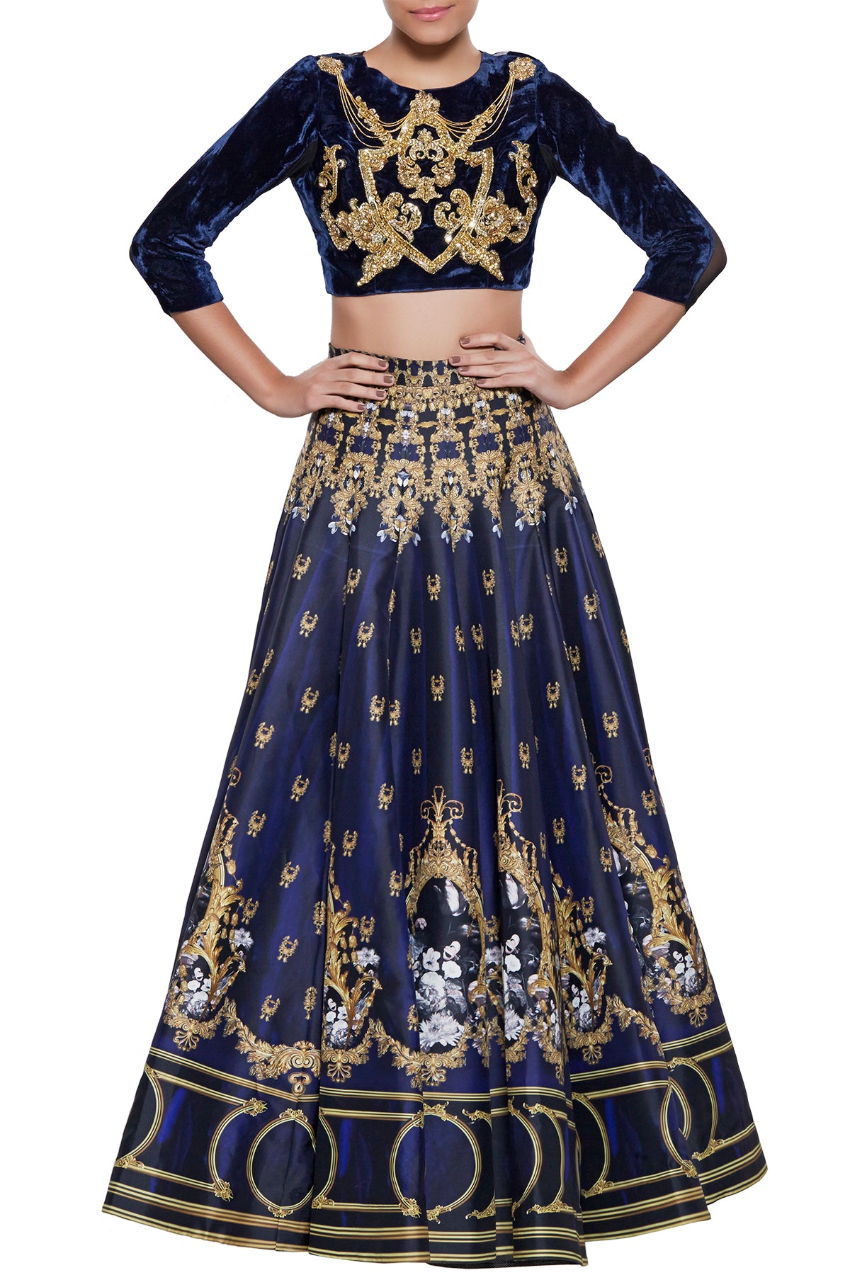 Cascading in silk with a class of the ages, our printed navy lehenga like a midnight dream is your best bet for the next big royal wedding. Its velvet and mesh crop top is a sheer masterpiece and keeps the outfit a step ahead of the season.