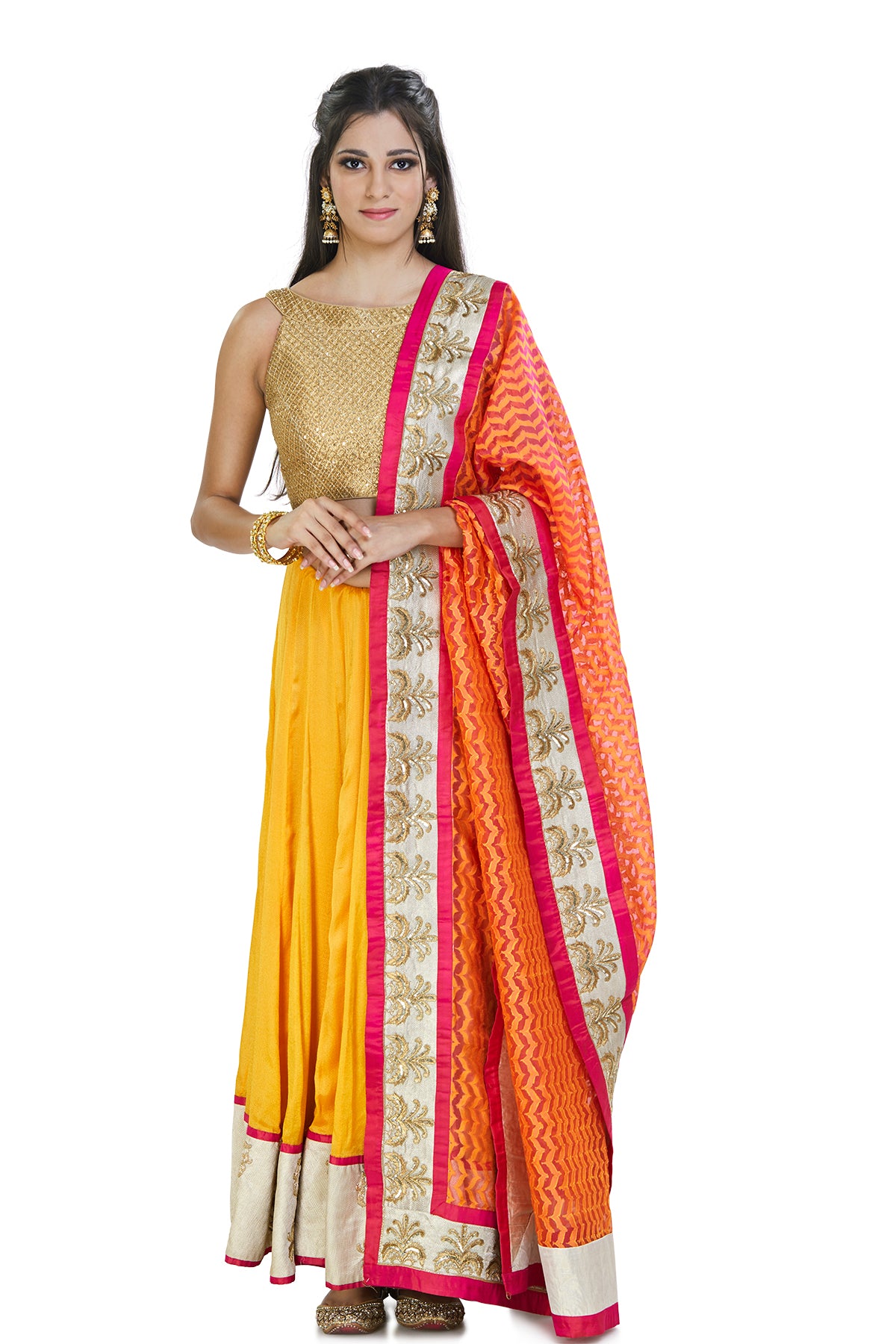 Vibrant & versatile, this saffron-colored silk, hand-embroidered skirt is complemented with a kardana embroidered fold blouse and pink chanderi dupatta.