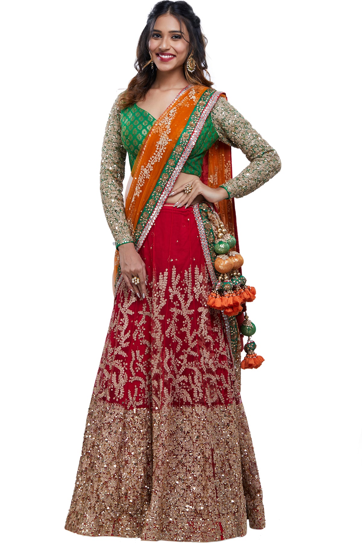 BFF's big day means a big fashion moment for you! Get it right in this full-sleeved green brocade & gold dori embroidered blouse with a red net lehenga & orange net dupatta. 