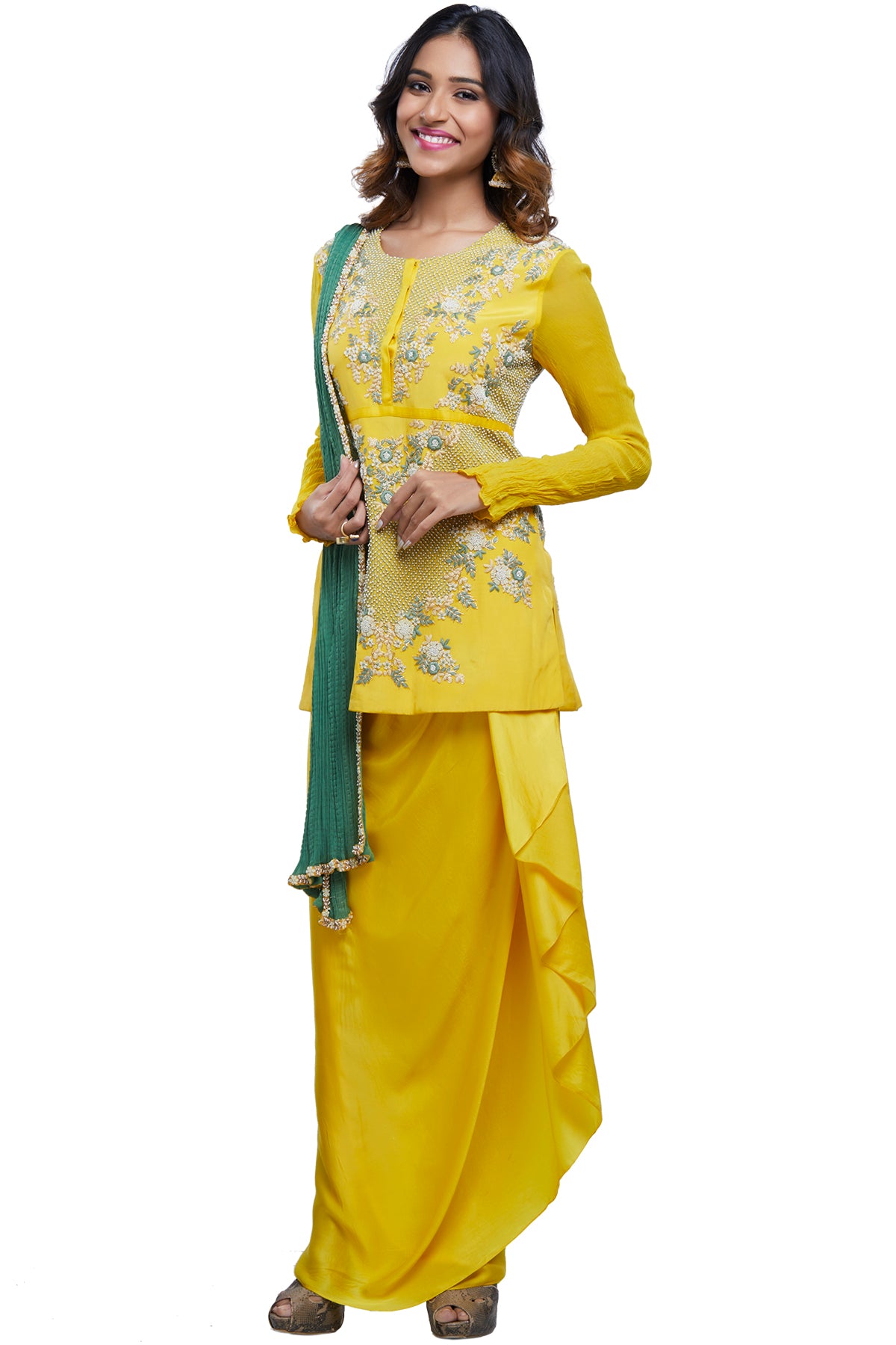 Speaking of sunshine, this raw yellow jhaal and pearl-embroidered short top is paired with a drape wrap skirt and embroidered crinkled georgette dupatta.