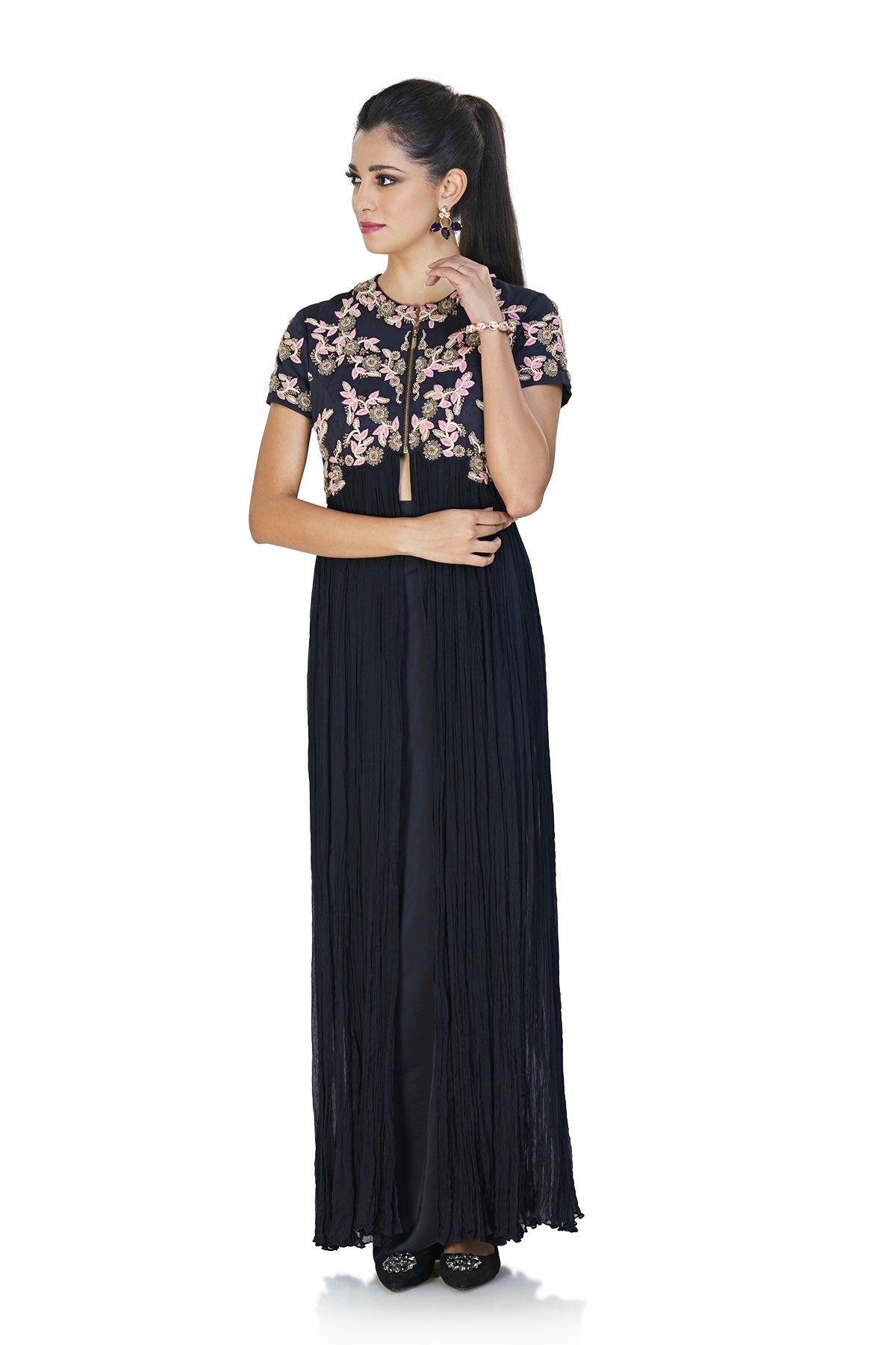 Buckle up with our bold, black, open-front long chiffon jacket with a separate draped skirt. This piece is crafted with pink & gold dabka, thread and zardosi embroidery in marigold flowers on bajji silk.