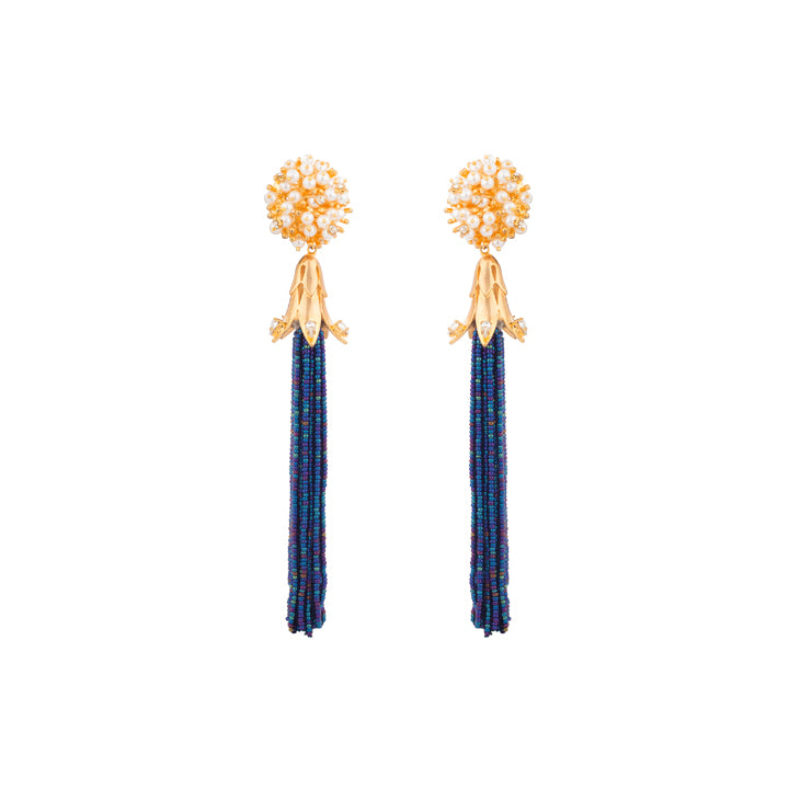 Set the dance floor ablaze in these beaded tassel earrings in deep blue cascading from gold. pearl and crystal-encrusted studs.