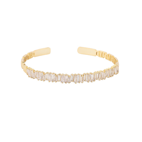 Nothing is more gorgeous than the sight of glittering gold. This heavenly line of pure baguette crystals are set in mixed metal alloy with a gold finish.
