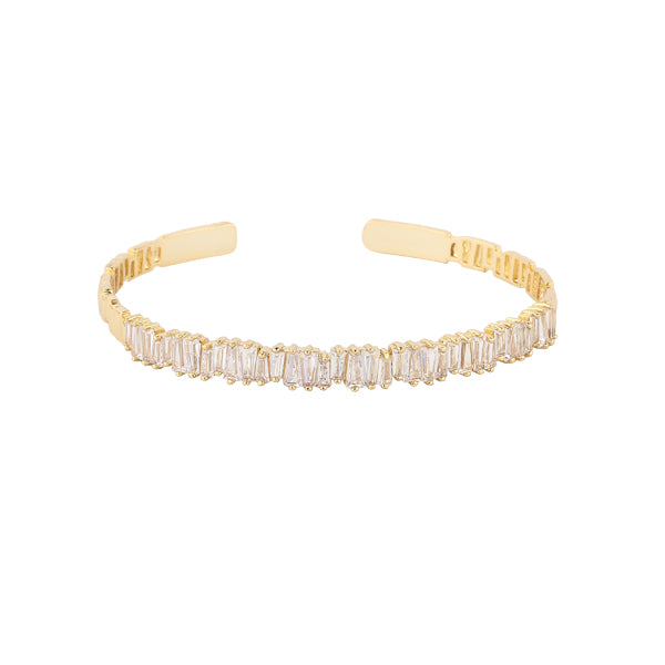Nothing is more gorgeous than the sight of glittering gold. This heavenly line of pure baguette crystals are set in mixed metal alloy with a gold finish.
