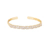 Nothing is more gorgeous than the sight of glittering gold. This heavenly line of pure baguette crystals are set in mixed metal alloy with a gold finish.
