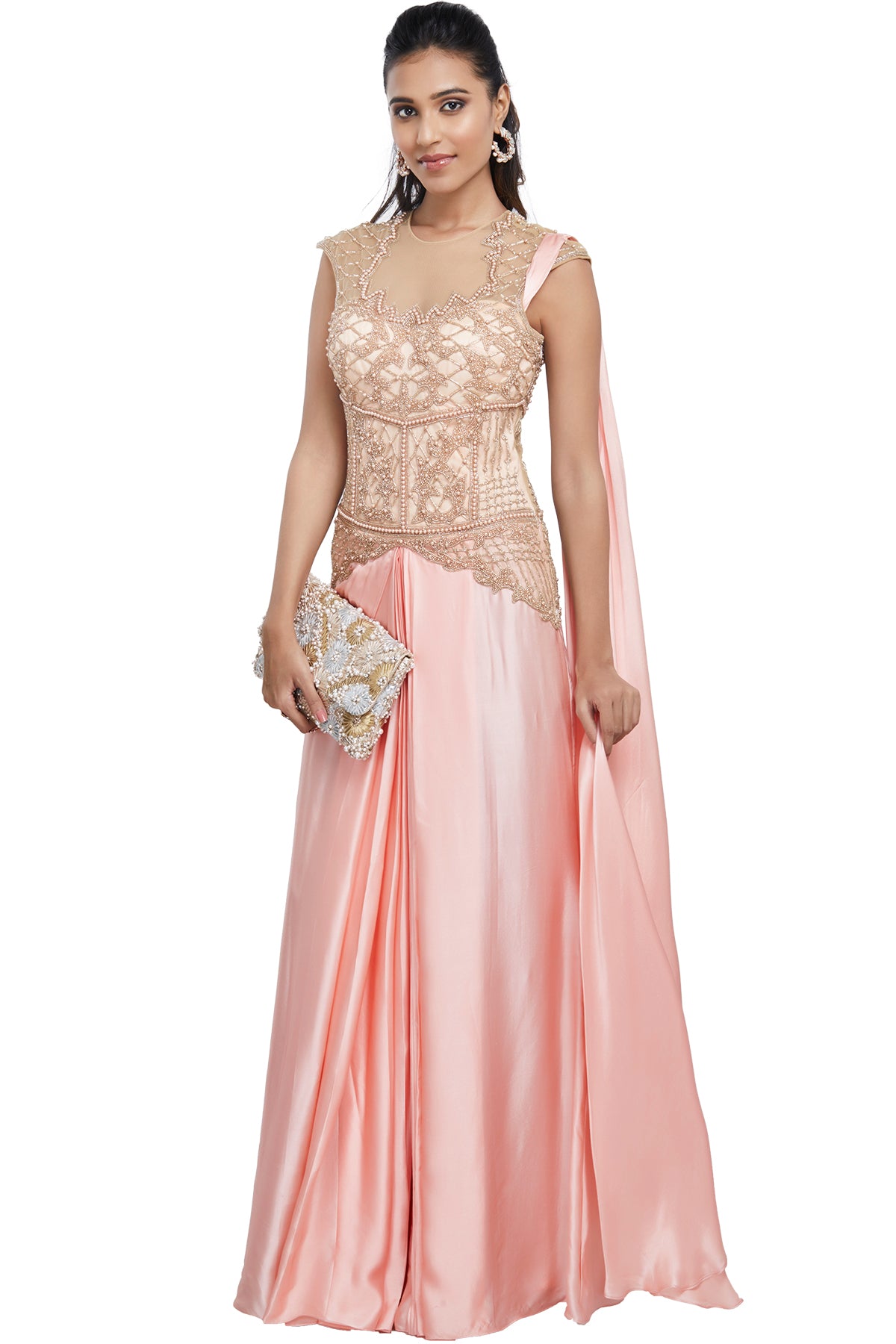 The epitome of east meets west, this baby pink soft net and cotton satin lehenga sari has a well-fitted, defining gold pearl & bead embroidered bodice. For your comfort, the outfit has a side zip and snap button closure on the shoulder.