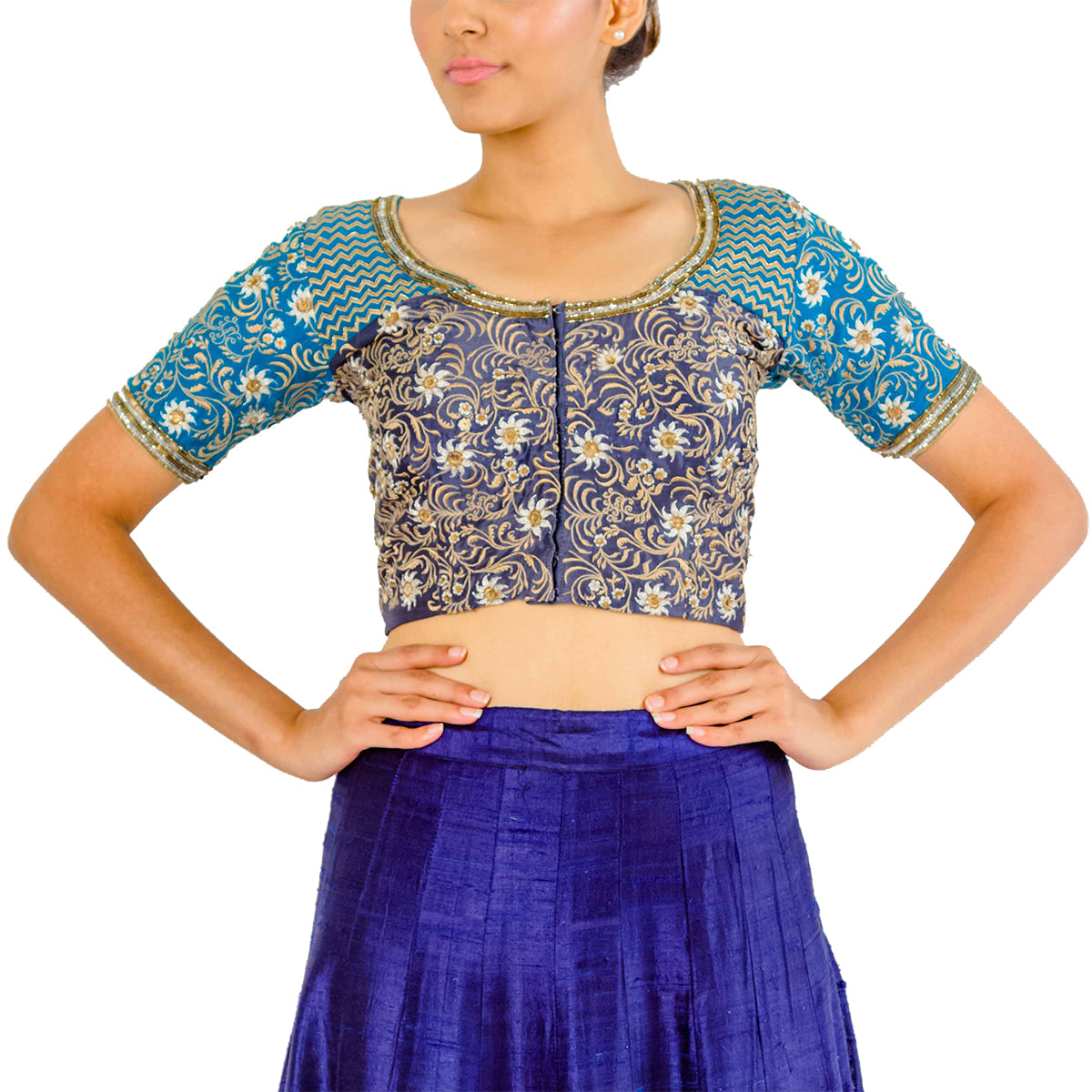 In the pretty myriad of the peacock - this light and dark blue silk patched choli is full of threadwork, zari and sequins embroidery. 