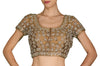 An every wardrobe staple for the wedding season, weave in some serious magic with this dark gold blouse with delicate cut-work embroidery highlighted with stones.