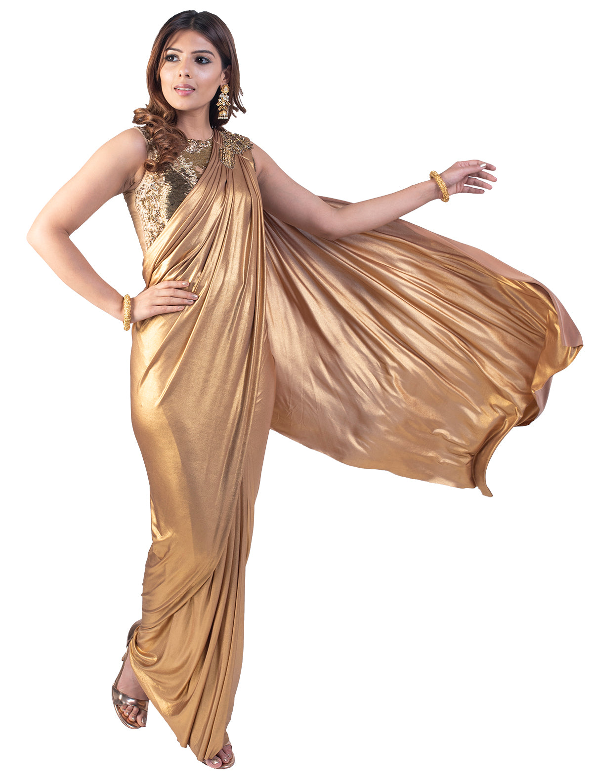 The gold over gold is an unusual mixture but still is unbelievably pleasing. The sleeveless blouse has shimmery look to it. The saree is an absolute art.