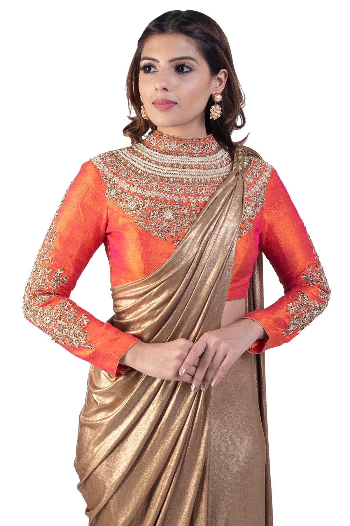 The orange-gold combo never gets old. This beautiful embroidery over the full sleeve blouse makes it look majestic.  Moreover the glowing Velvet touch saree is nothing but a charmer. Don't miss on the not.