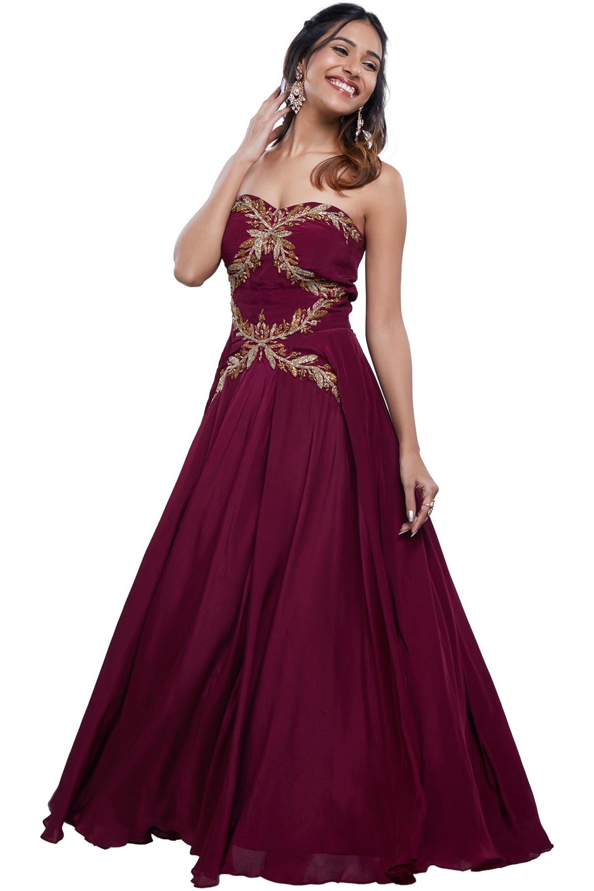 Rage through the night with this strapless maroon gown in satin silk with pita and zardosi work.