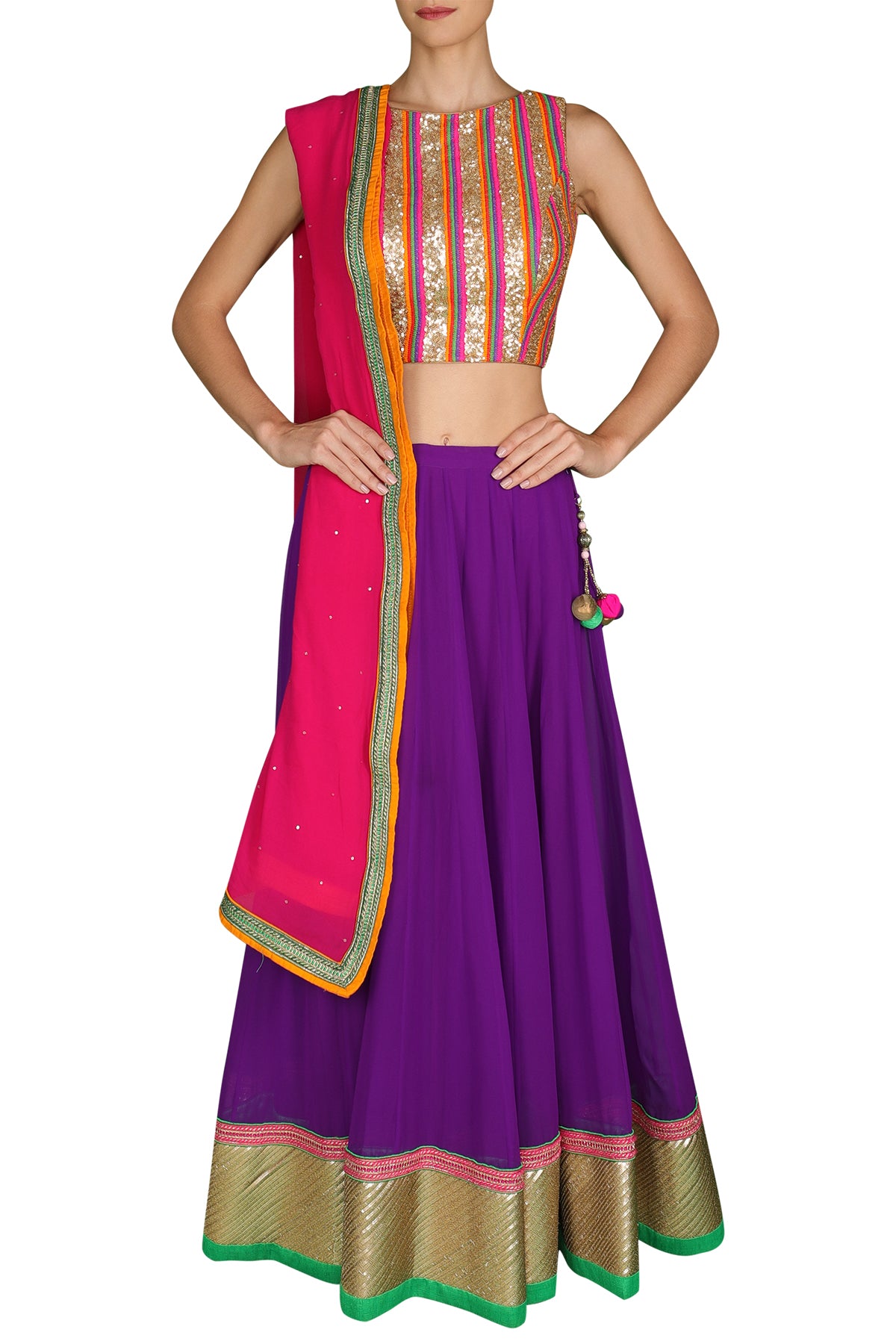 Lose yourself to the vibrant multi-colours of this vivacious wonder. Slip into its high neck sequin blouse with a futuristic feel and its purple georgette lehenga with a pink and orange shaded dupatta.
